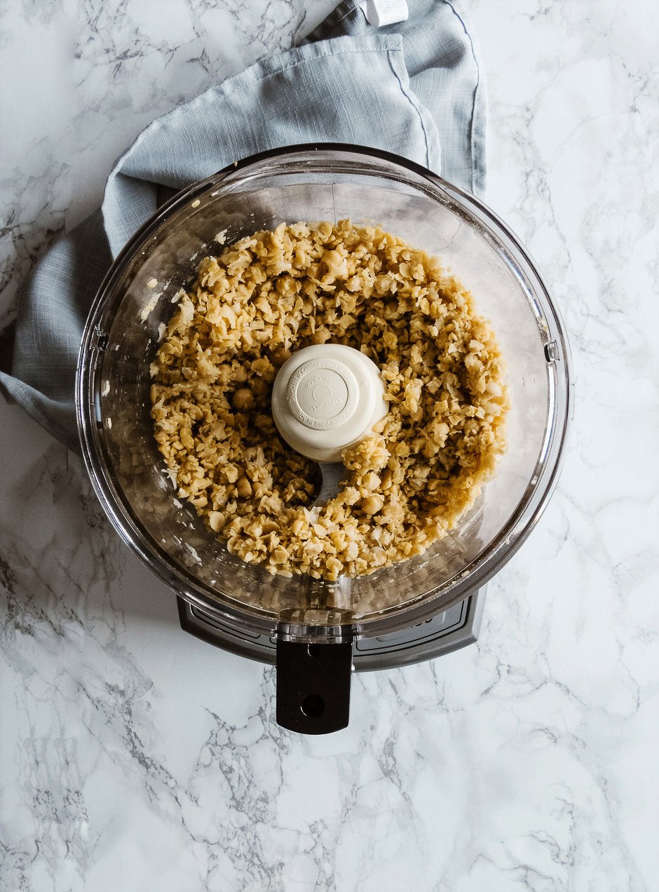 overhead image of chickpeas in a food processor.