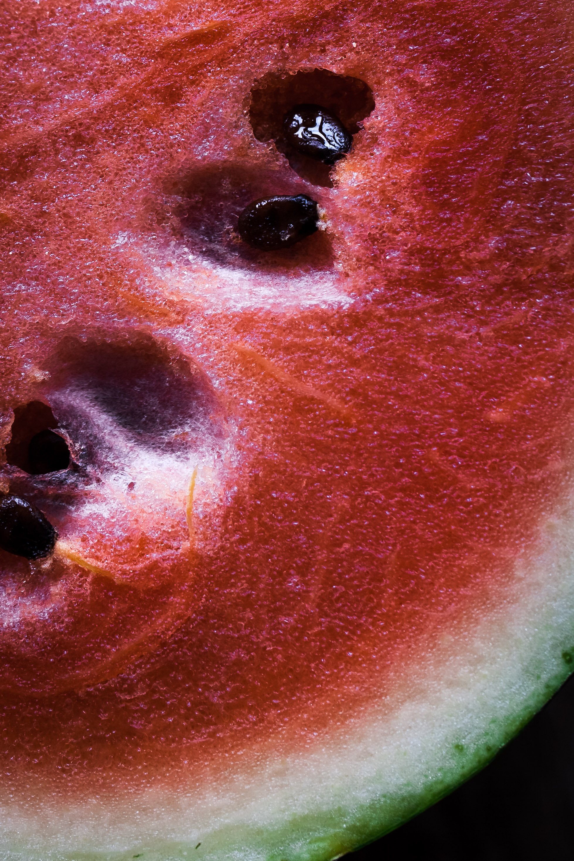overhead closeup view of a watermelon slice.