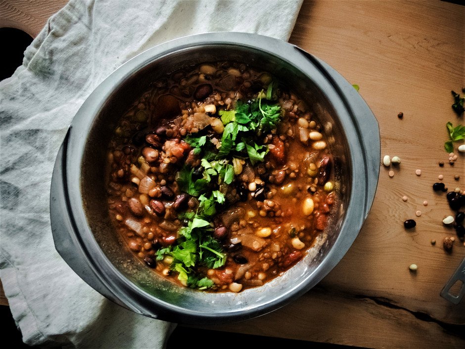 overhead image of seven bean soup in a metal dish.