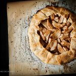overhead view of an apple galette on a baking tray.