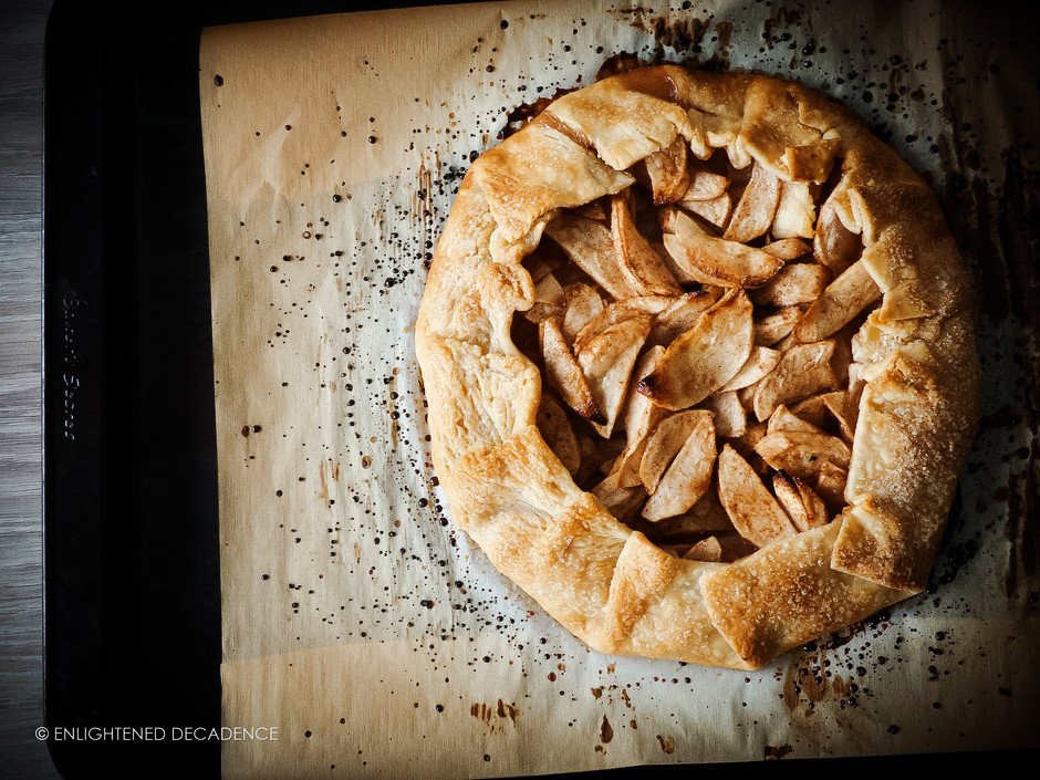 overhead image of a galette sitting on a parchment paper.